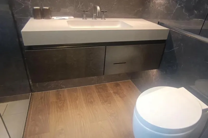  Yacht Photos Pics Modern bathroom on 2021 Sunreef 80 Power yacht with sleek sink and toilet.