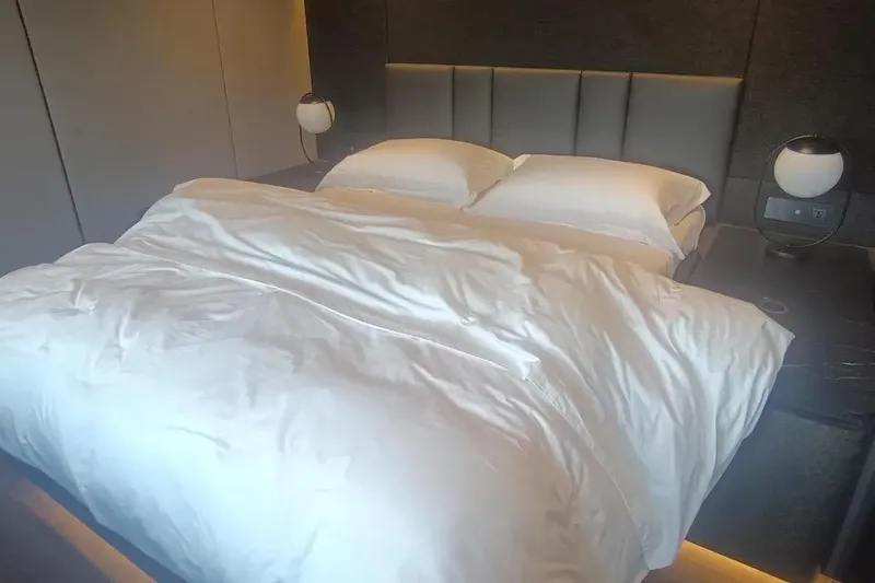  Yacht Photos Pics Luxurious bedroom interior on 2021 Sunreef 80 Power yacht with elegant bedding.