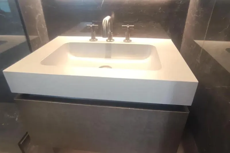  Yacht Photos Pics Modern bathroom sink on Sunreef 80 Power yacht, 2021 model, with sleek design and fixtures.