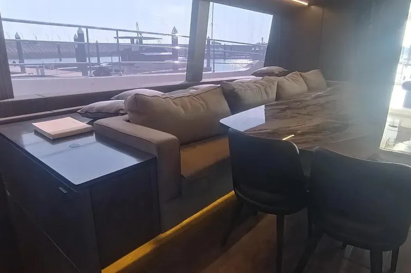  Yacht Photos Pics Luxurious interior of 2021 Sunreef 80 Power yacht with elegant seating and large windows.