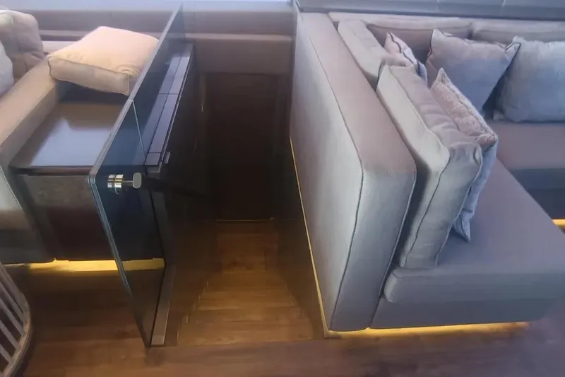  Yacht Photos Pics Luxurious interior of 2021 Sunreef 80 Power yacht with modern seating and glass door.