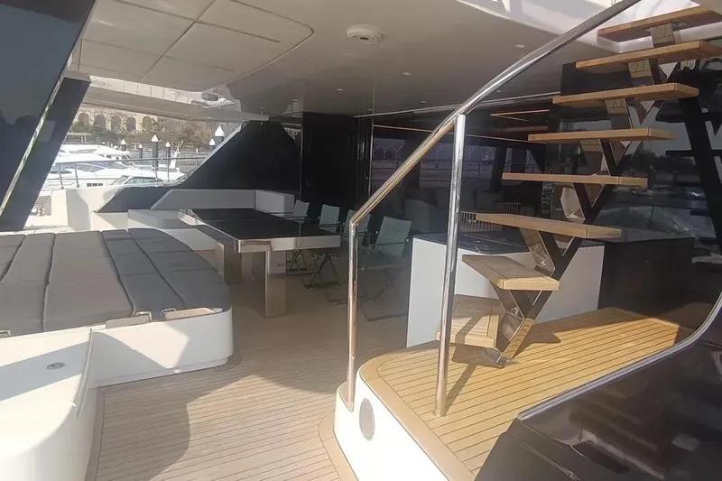  Yacht Photos Pics Luxurious Sunreef 80 Power yacht interior, featuring modern seating and elegant wooden staircase, 2021 model.