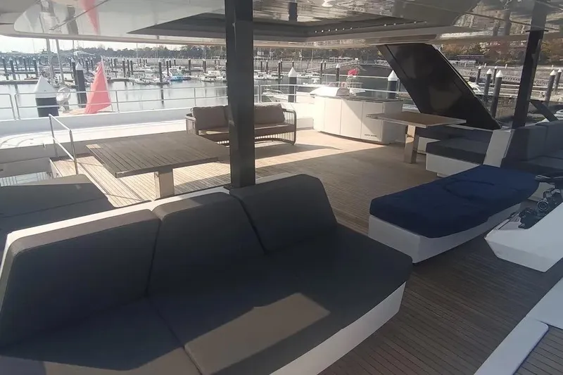  Yacht Photos Pics Luxurious Sunreef 80 Power yacht deck with modern seating, 2021 model, docked at marina.