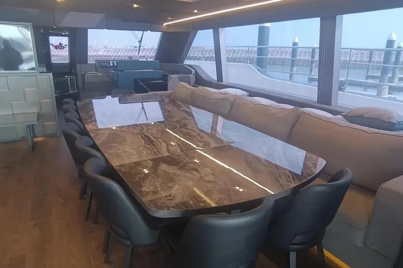 Yacht Photos Pics Luxurious interior of 2021 Sunreef 80 Power yacht with elegant dining area and panoramic windows.