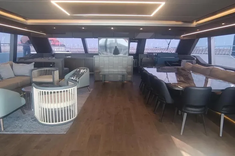  Yacht Photos Pics Luxurious interior of 2021 Sunreef 80 Power yacht with elegant seating and dining area.