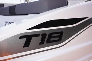 2025 Tahoe T18 boat close-up, featuring sleek black and silver design elements.