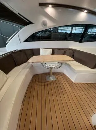  Yacht Photos Pics Luxurious seating area on a 2013 Sessa Marine C 48 yacht with wooden flooring.