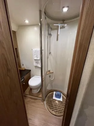  Yacht Photos Pics 2013 Sessa Marine C 48 yacht bathroom with shower, toilet, and wooden accents.