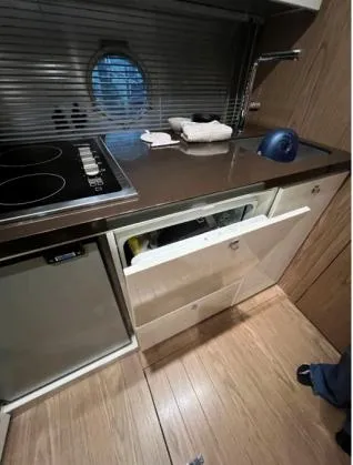  Yacht Photos Pics 2013 Sessa Marine C 48 yacht kitchen with stove, sink, and storage drawers.