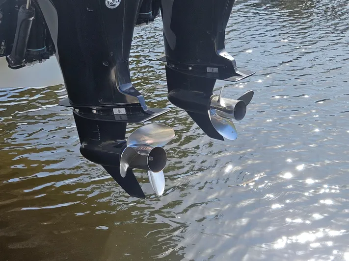  Yacht Photos Pics Twin outboard motors of a 2005 Boston Whaler 305 Conquest on water.