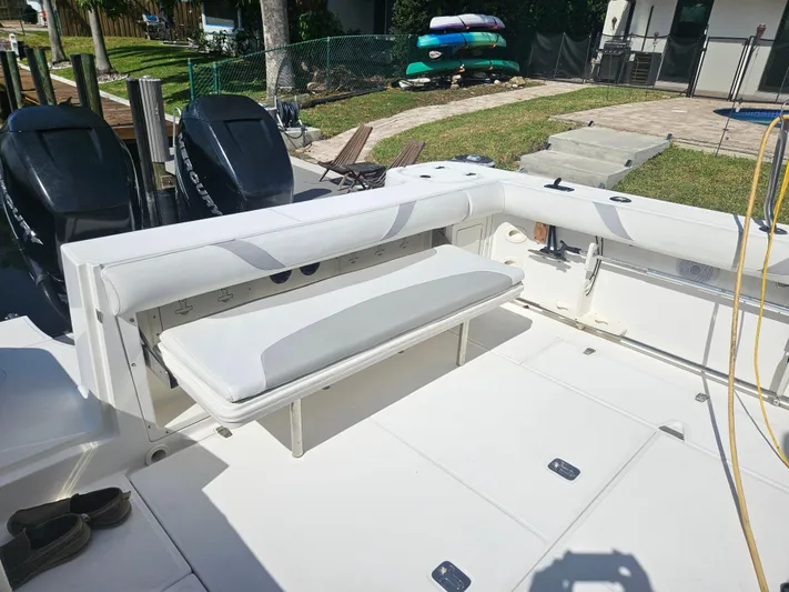  Yacht Photos Pics 2005 Boston Whaler 305 Conquest boat interior with seating and dual engines.