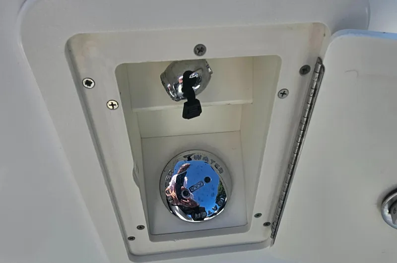  Yacht Photos Pics 2005 Boston Whaler 305 Conquest boat compartment with chrome fixture and latch.