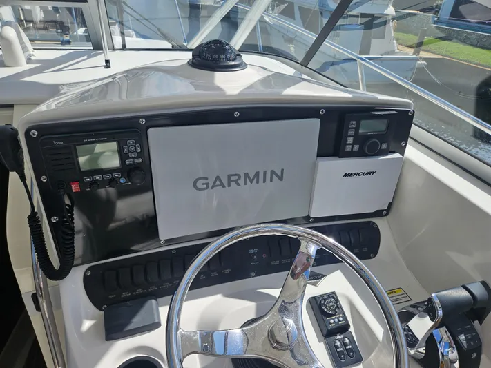  Yacht Photos Pics Control panel of a 2005 Boston Whaler 305 Conquest with Garmin navigation system.