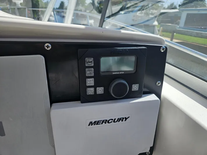  Yacht Photos Pics Control panel on a 2005 Boston Whaler 305 Conquest boat with Mercury system.