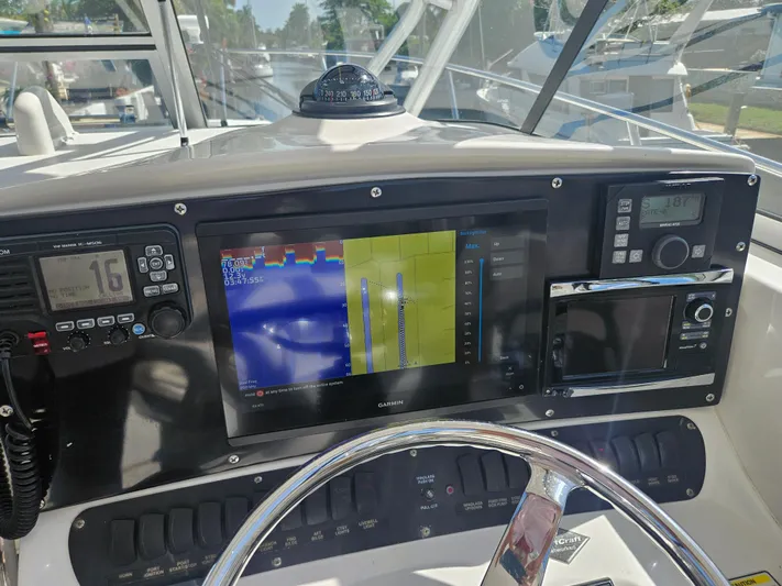  Yacht Photos Pics 2005 Boston Whaler 305 Conquest dashboard with navigation and communication equipment.