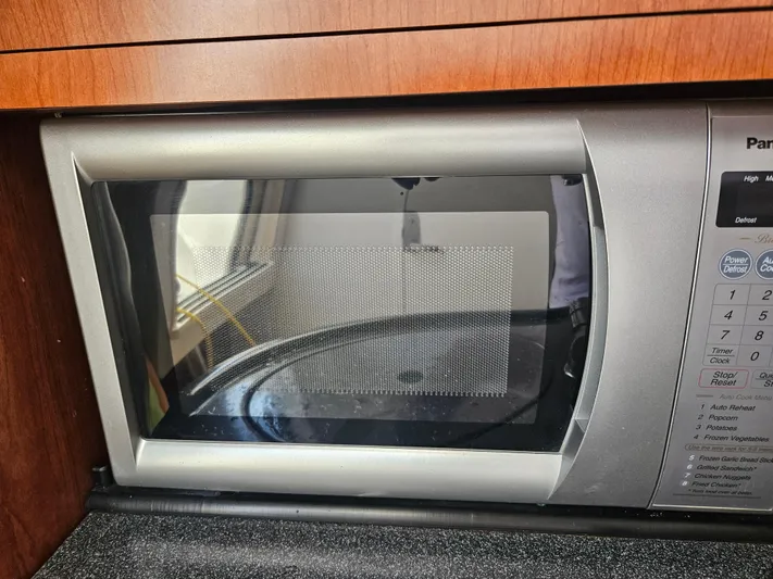  Yacht Photos Pics Microwave oven inside a 2005 Boston Whaler 305 Conquest boat kitchen area.