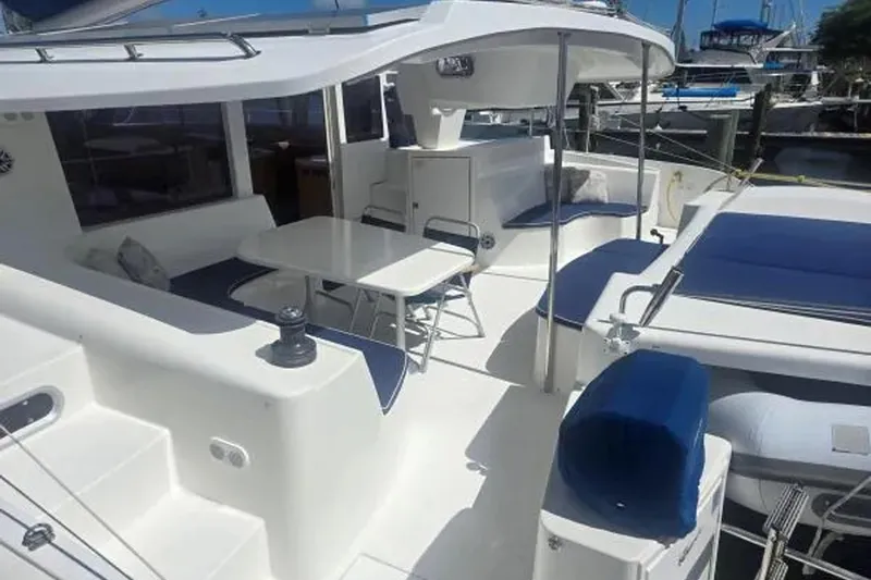 Sunbelievable Yacht Photos Pics 2008 Fountaine Pajot Salina 48 Evolution catamaran with spacious deck and seating area.