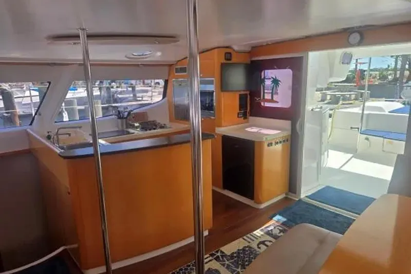 Sunbelievable Yacht Photos Pics Interior of 2008 Fountaine Pajot Salina 48 Evolution catamaran, featuring modern kitchen and seating area.