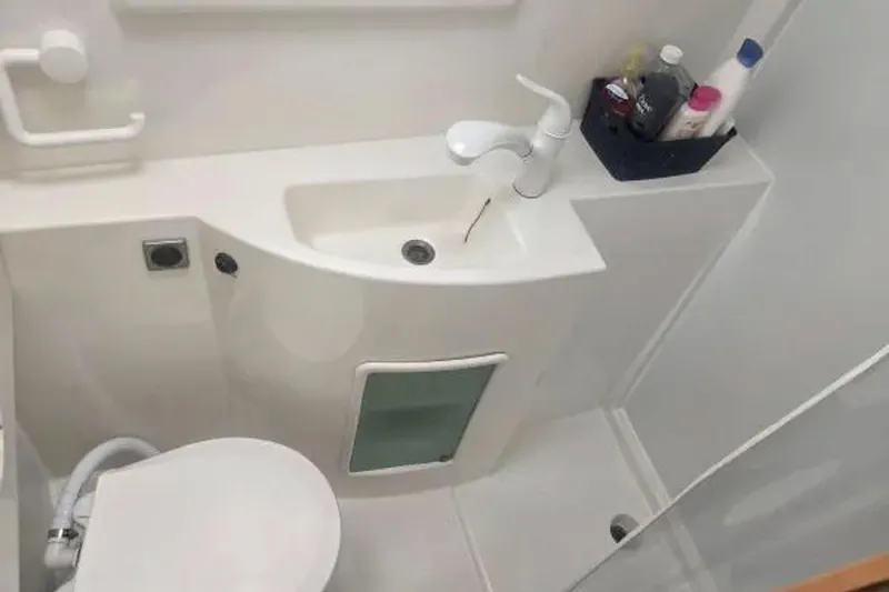 Sunbelievable Yacht Photos Pics Bathroom interior of 2008 Fountaine Pajot Salina 48 Evolution yacht, featuring sink and toiletries.