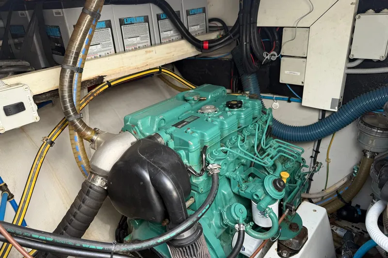 Sunbelievable Yacht Photos Pics Engine room of 2008 Fountaine Pajot Salina 48 Evolution catamaran, showcasing mechanical components.