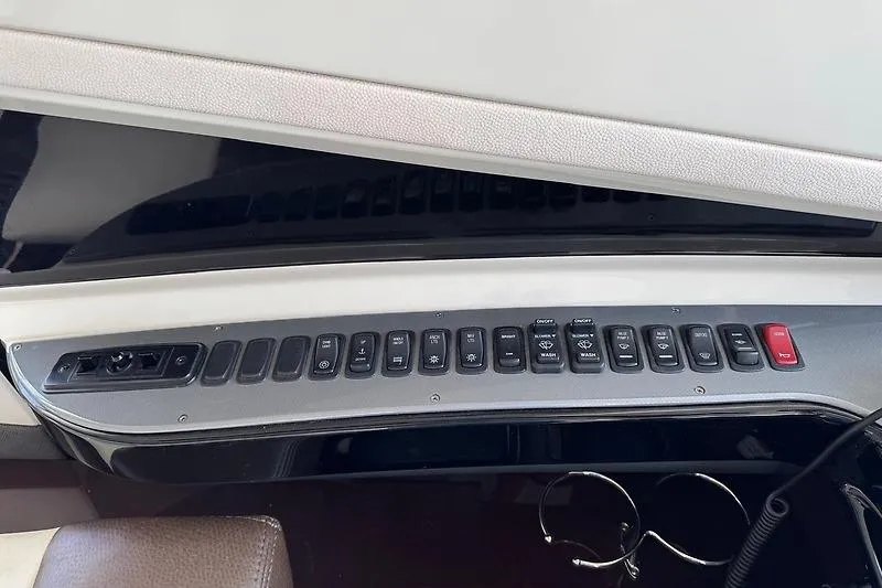  Yacht Photos Pics Control panel of a 2012 Marquis 500 Sport Bridge yacht with multiple switches.