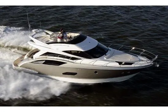  Yacht Photos Pics 2012 Marquis 500 Sport Bridge yacht cruising on open water.