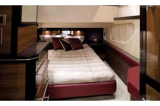  Yacht Photos Pics Luxurious interior cabin of 2012 Marquis 500 Sport Bridge yacht with elegant bedding.