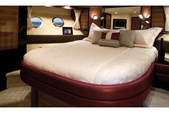  Yacht Photos Pics Luxurious bedroom interior of 2012 Marquis 500 Sport Bridge yacht with elegant bedding.