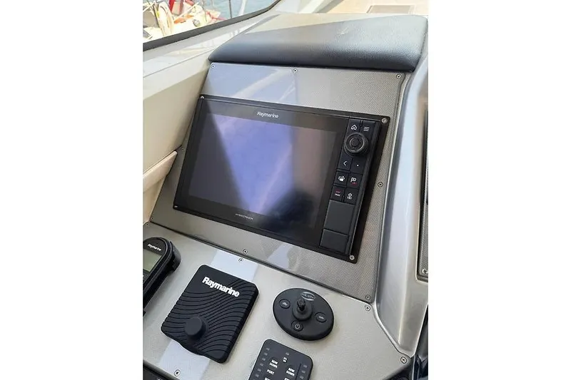  Yacht Photos Pics Control panel of a 2012 Marquis 500 Sport Bridge yacht with Raymarine navigation system.
