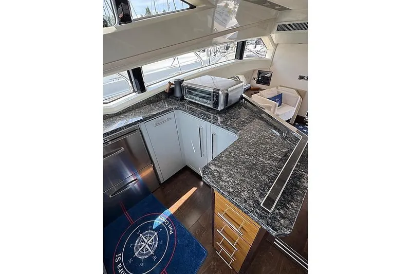  Yacht Photos Pics Luxurious 2012 Marquis 500 Sport Bridge yacht kitchen with granite countertops and modern appliances.