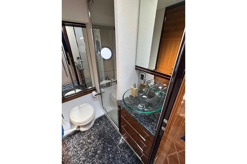  Yacht Photos Pics Luxurious bathroom in 2012 Marquis 500 Sport Bridge yacht with modern fixtures and elegant design.