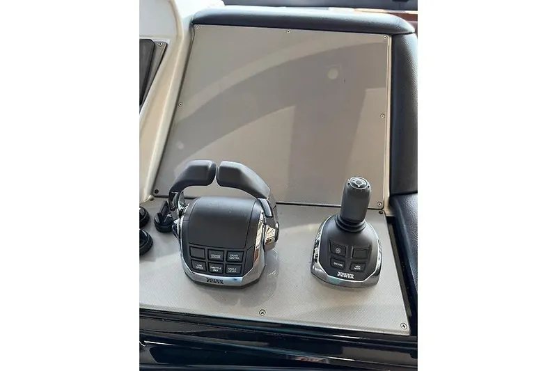  Yacht Photos Pics Control panel of 2012 Marquis 500 Sport Bridge yacht with joystick and throttle.