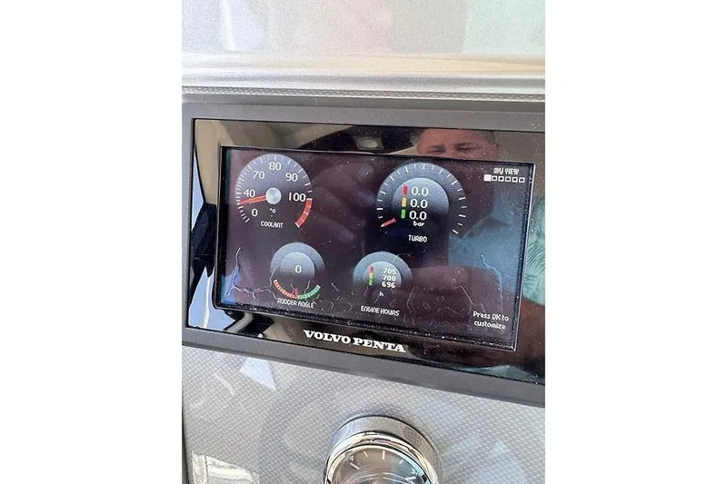  Yacht Photos Pics Dashboard of a 2012 Marquis 500 Sport Bridge with Volvo Penta display showing gauges.