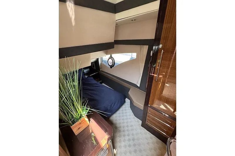  Yacht Photos Pics Luxurious interior cabin of 2012 Marquis 500 Sport Bridge yacht with modern furnishings.