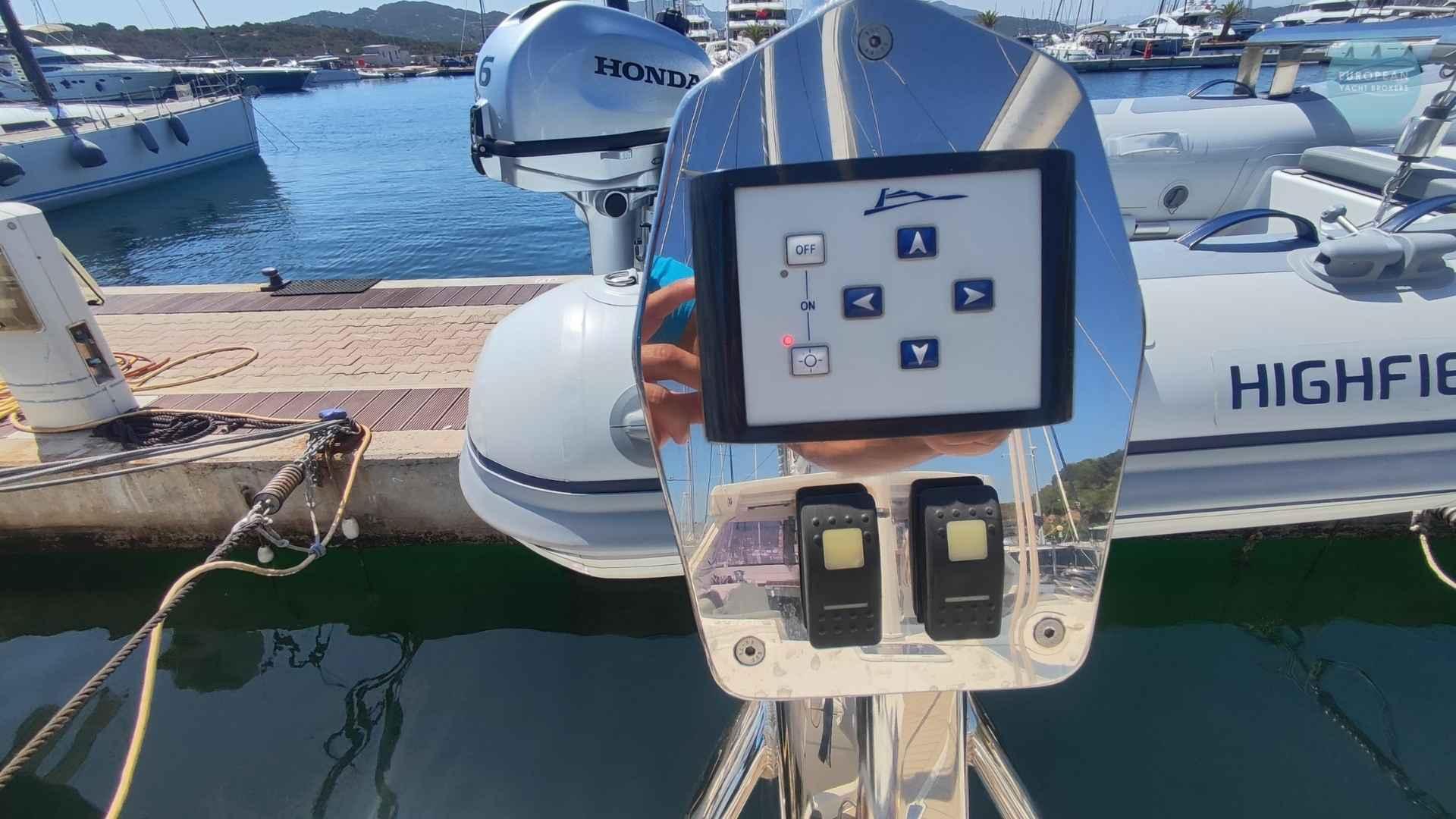 Control panel on a 2017 Amel 55 yacht docked at a marina.