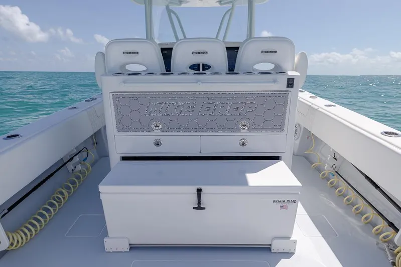  Yacht Photos Pics 2023 Contender 39 ST boat interior with seating and storage, on open water.