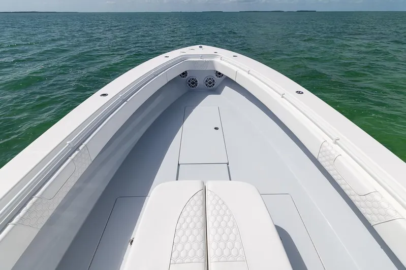  Yacht Photos Pics 2023 Contender 39 ST boat on open water, showcasing sleek design and spacious deck.