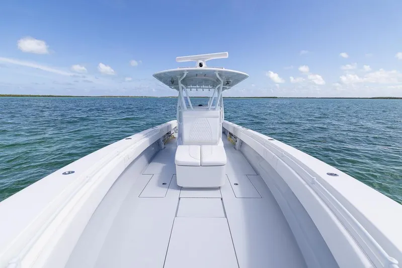  Yacht Photos Pics 2023 Contender 39 ST boat on open water under clear blue sky.