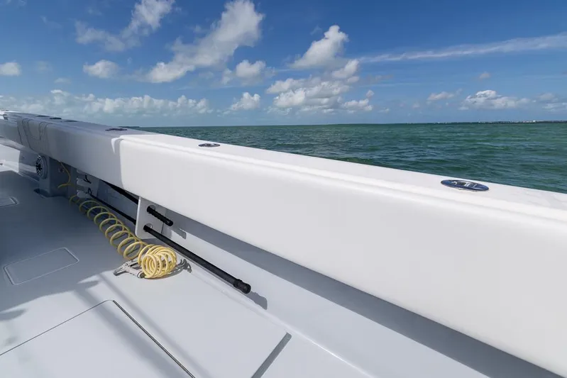  Yacht Photos Pics 2023 Contender 39 ST boat deck with ocean view and blue sky.