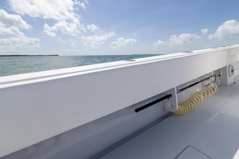  Yacht Photos Pics 2023 Contender 39 ST boat deck with ocean view under blue sky.