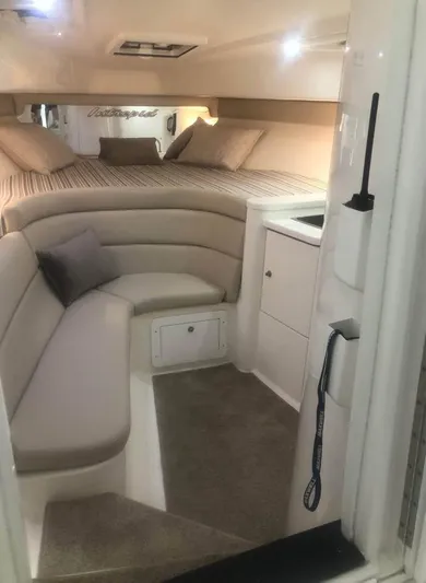  Yacht Photos Pics Interior of a 2002 Intrepid 348 WA boat with cozy seating and bed.
