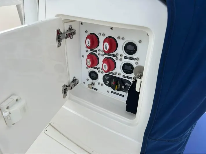  Yacht Photos Pics Control panel inside a 2002 Intrepid 348 WA boat, featuring switches and gauges.