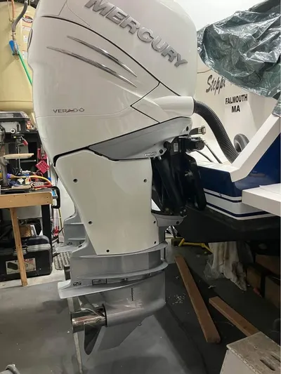  Yacht Photos Pics Mercury Verado outboard motor on 2002 Intrepid 348 WA boat in garage setting.