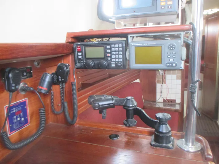  Yacht Photos Pics Navigation equipment on a 1990 Pacific Seacraft 37 sailboat, featuring radios and GPS systems.