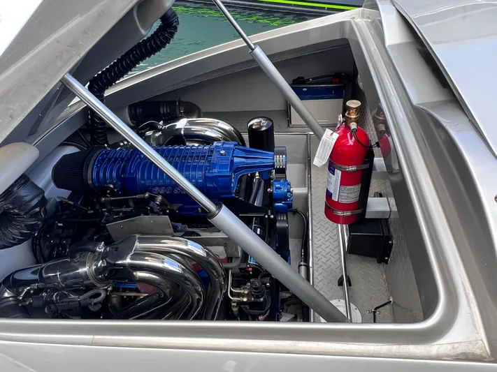 Unique Yacht Photos Pics Engine compartment of a 2008 Porsche/Donzi boat with visible fire extinguisher.