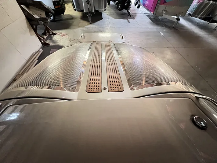 Unique Yacht Photos Pics 2008 Porsche Donzi with sleek metallic finish and vented hood in a garage setting.