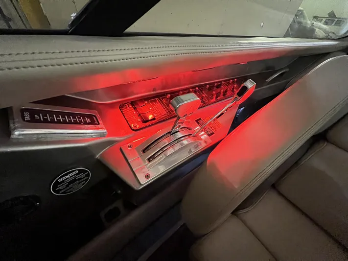 Unique Yacht Photos Pics Interior of a 2008 Porsche/Donzi with illuminated gear controls and red ambient lighting.