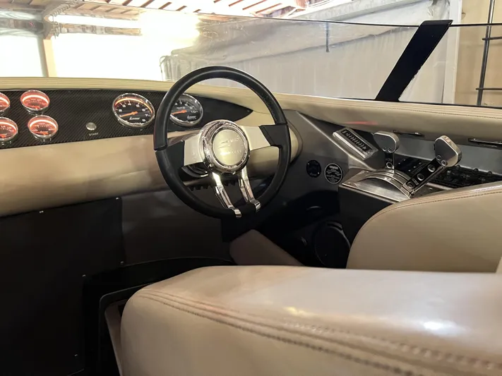 Unique Yacht Photos Pics Interior of a 2008 Porsche/Donzi with sleek dashboard and steering wheel design.