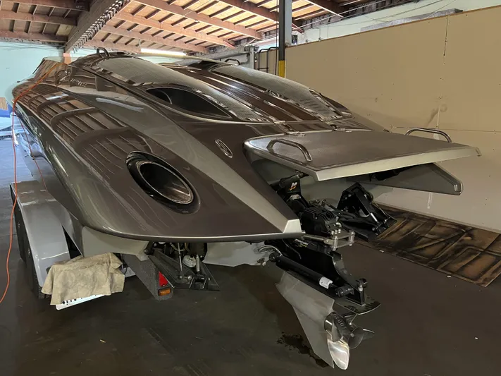 Unique Yacht Photos Pics 2008 Porsche Donzi boat in a garage, showcasing sleek design and powerful engine.