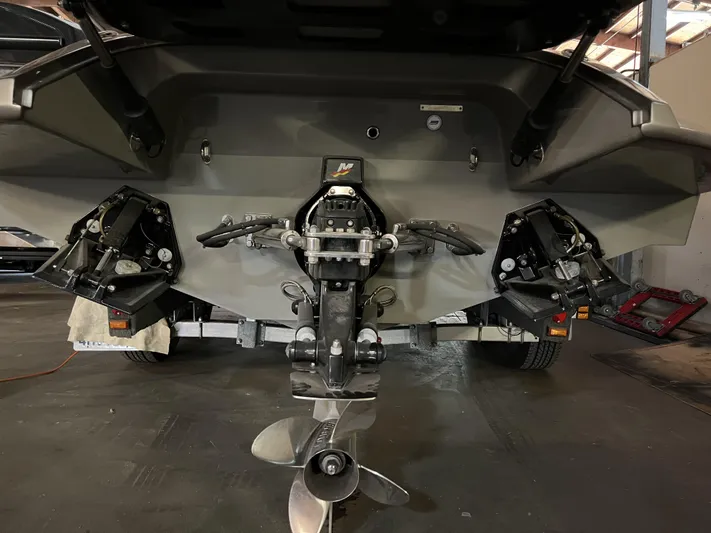 Unique Yacht Photos Pics Rear view of a 2008 Porsche/Donzi boat with visible propeller and outboard motor.